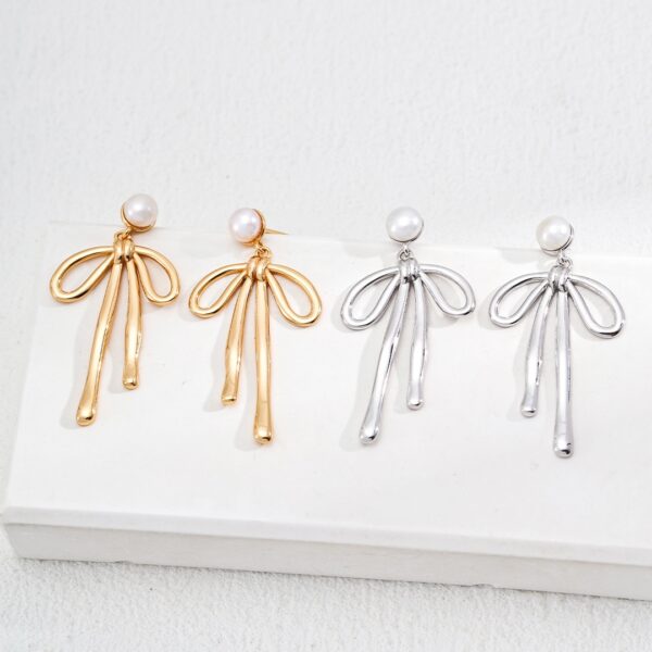 复古蝴蝶结金色耳环本夕